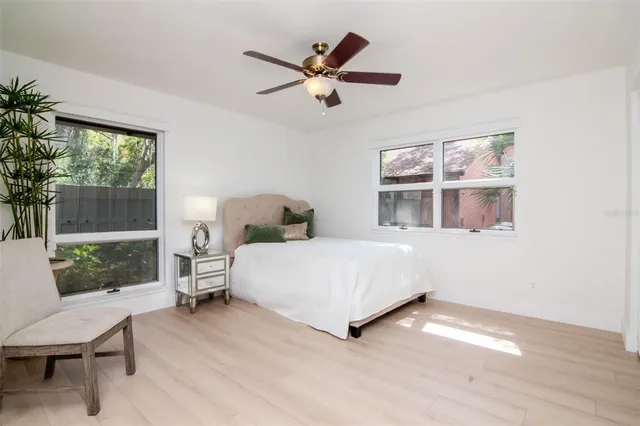 an aerial view of residential house with swimming pool and green space