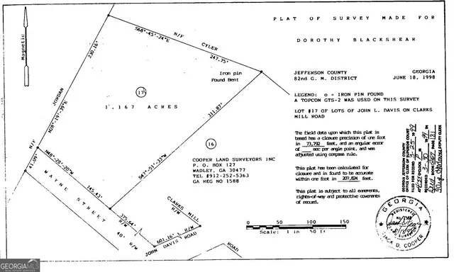 a aerial view of a house with a yard