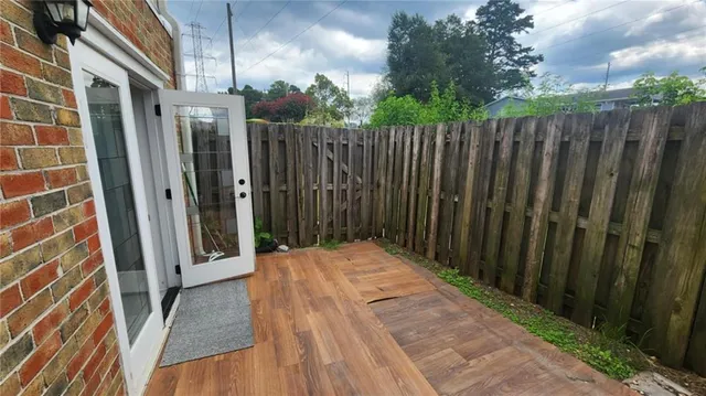 a view of a brick house with a backyard
