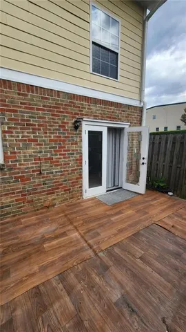 a view of staircase with wooden floor and white walls