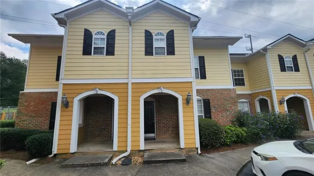 a front view of a house with yard