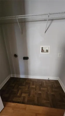 a bathroom with a granite countertop sink a toilet and a mirror