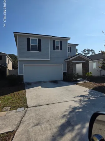 a front view of a house with a garage