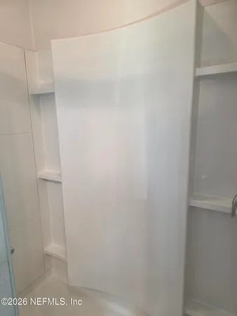 a view of a room with racks on the wall