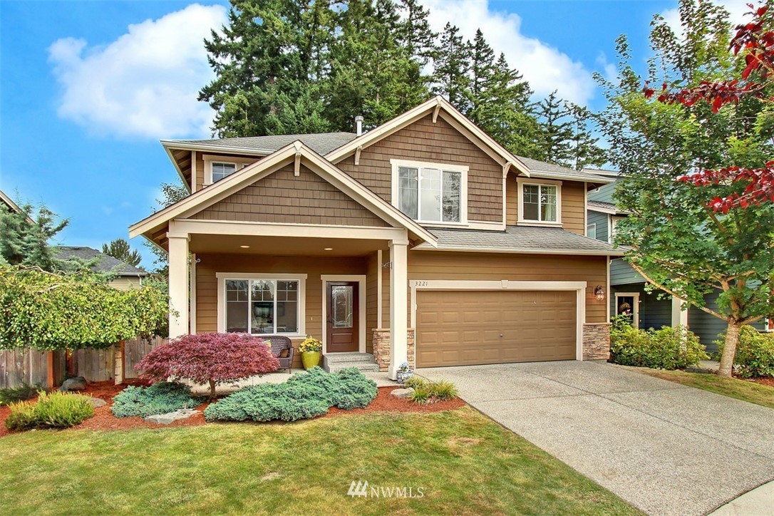 3221 172 Street Southeast Bothell, WA 98012 - Photo 1 of 23 a front view of a house with a garden and plants
