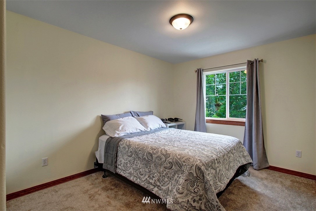 3221 172 Street Southeast Bothell, WA 98012 - Photo 14 of 23 a bedroom with a bed and window