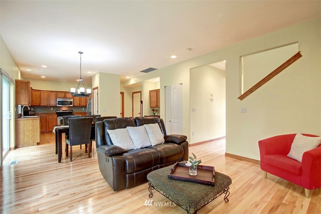 3221 172 Street Southeast Bothell, WA 98012 - Photo 7 of 23 a living room with furniture and kitchen view