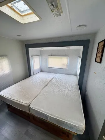 a room with a chair and a flat screen tv