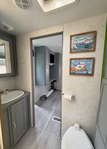 a bathroom with a sink and a mirror