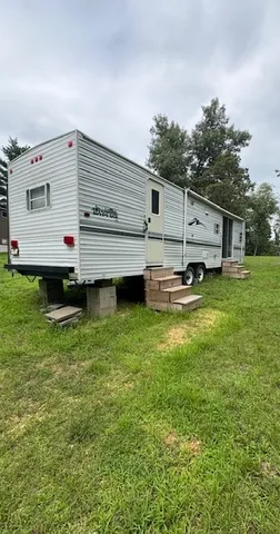 a view of a backyard with a sitting area