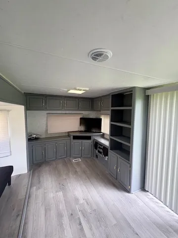 a kitchen with a sink and a stove top oven