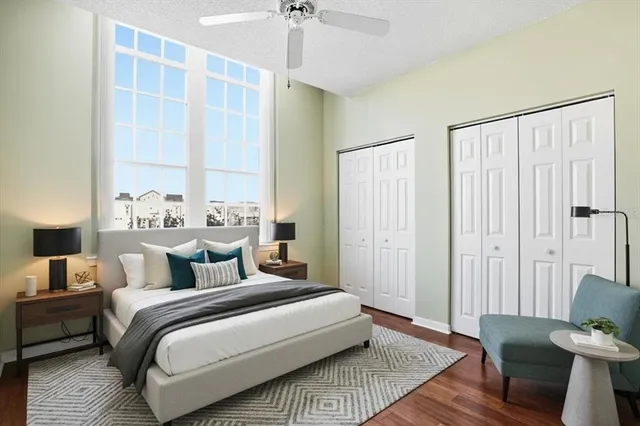 a bedroom with a large bed and a window