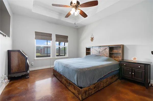 a bedroom with a bed and window