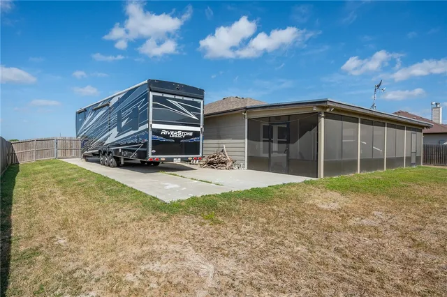 a swimming pool with outdoor seating and yard