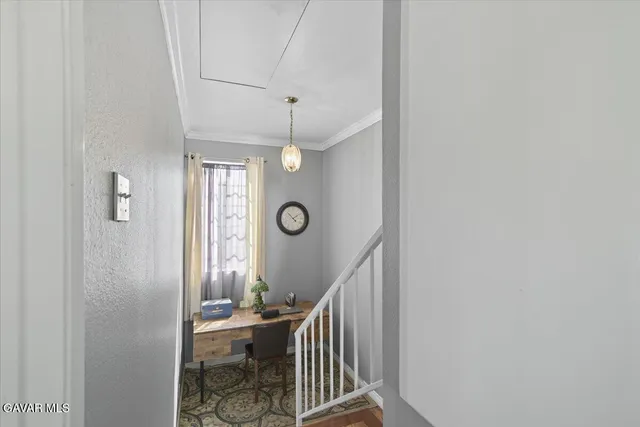 a view of entryway livingroom and hall with wooden floor