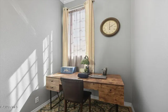 a view of a room with a table and a chair