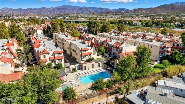an aerial view of a houses with outdoor space
