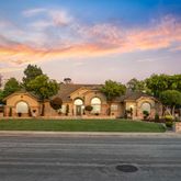 a view of a palm trees in front of a house