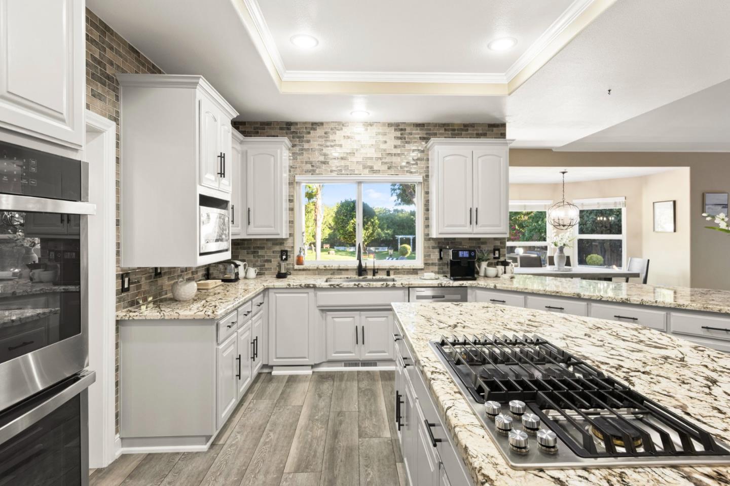 1980 Pear Drive Morgan Hill, CA 95037 - Photo 21 of 100 a kitchen with a stove a sink and a refrigerator