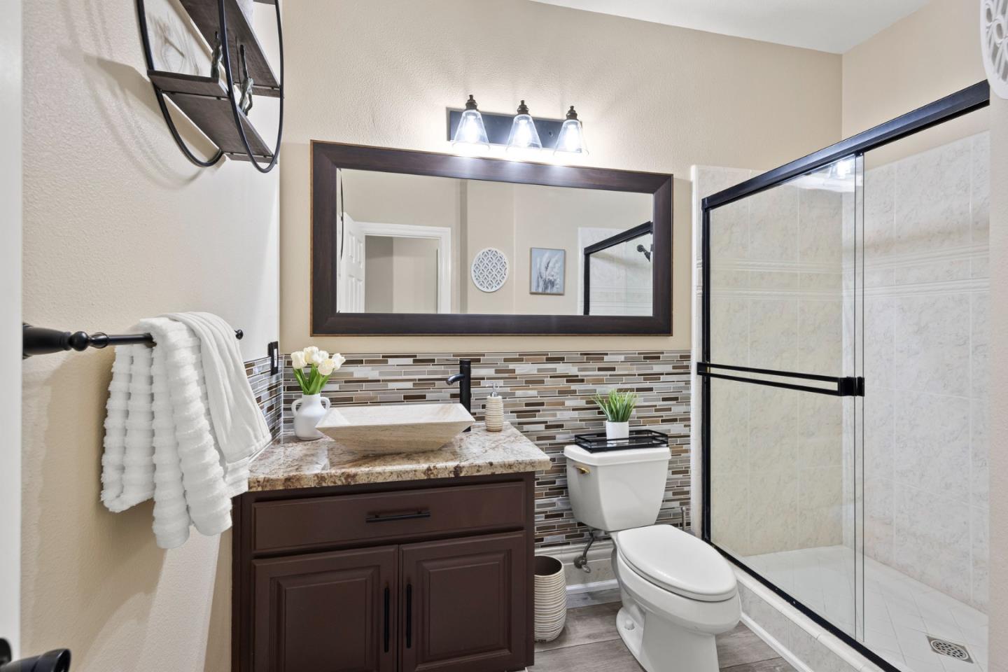 1980 Pear Drive Morgan Hill, CA 95037 - Photo 32 of 100 a bathroom with a granite countertop sink vanity mirror and toilet