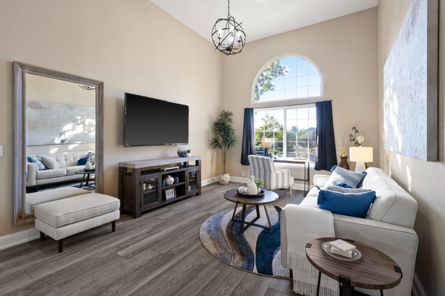 1980 Pear Drive Morgan Hill, CA 95037 - Photo 35 of 100 a living room with furniture a fireplace and a flat screen tv