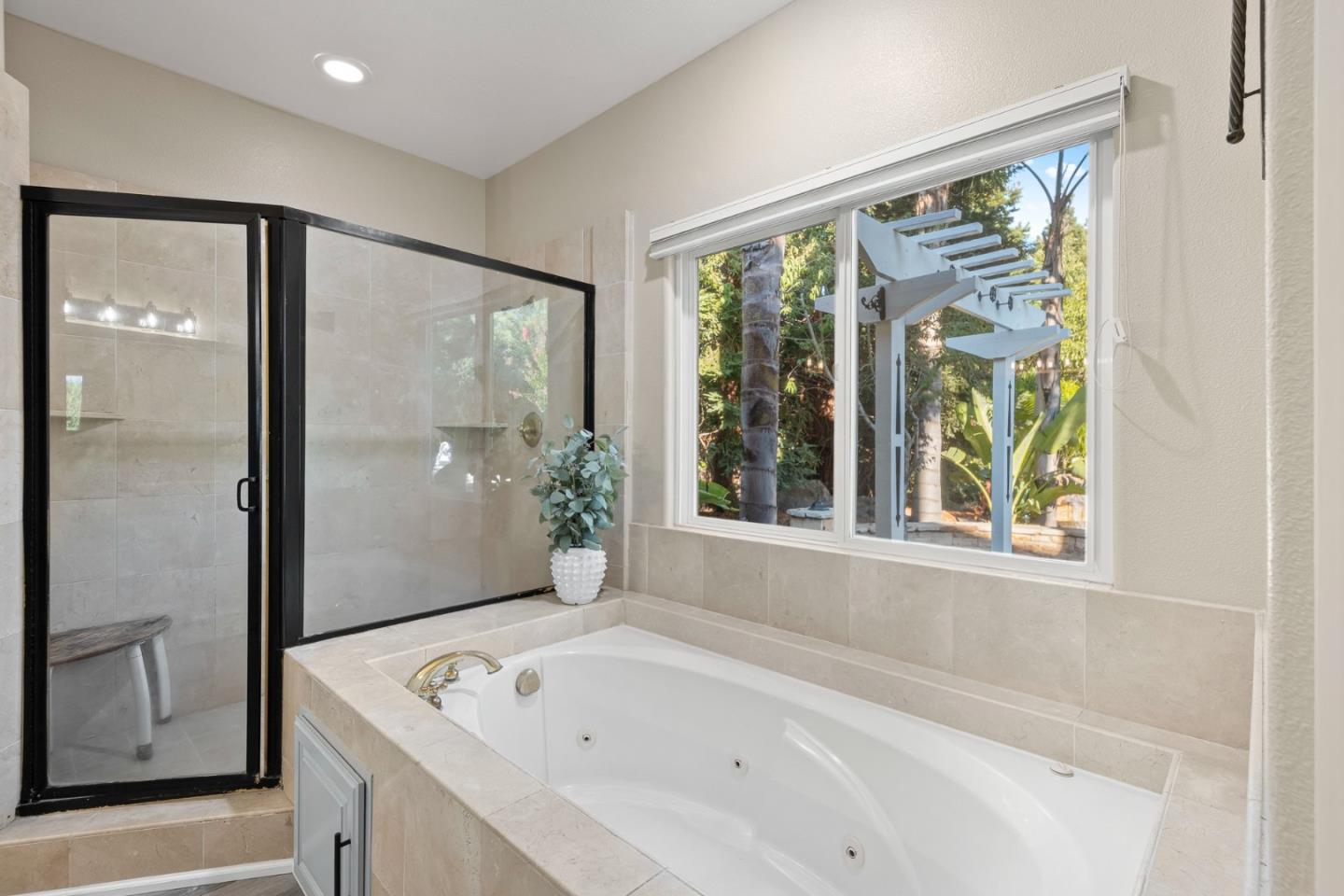 1980 Pear Drive Morgan Hill, CA 95037 - Photo 44 of 100 a bathroom with a bathtub and a shower