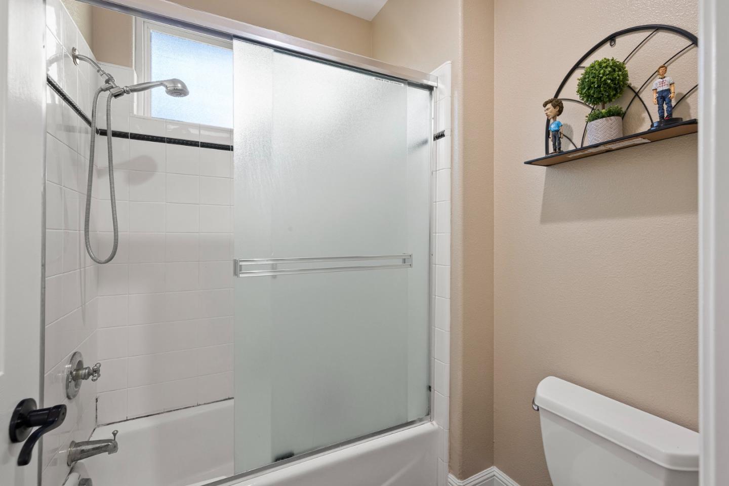 1980 Pear Drive Morgan Hill, CA 95037 - Photo 51 of 100 a bathroom with a shower and a toilet