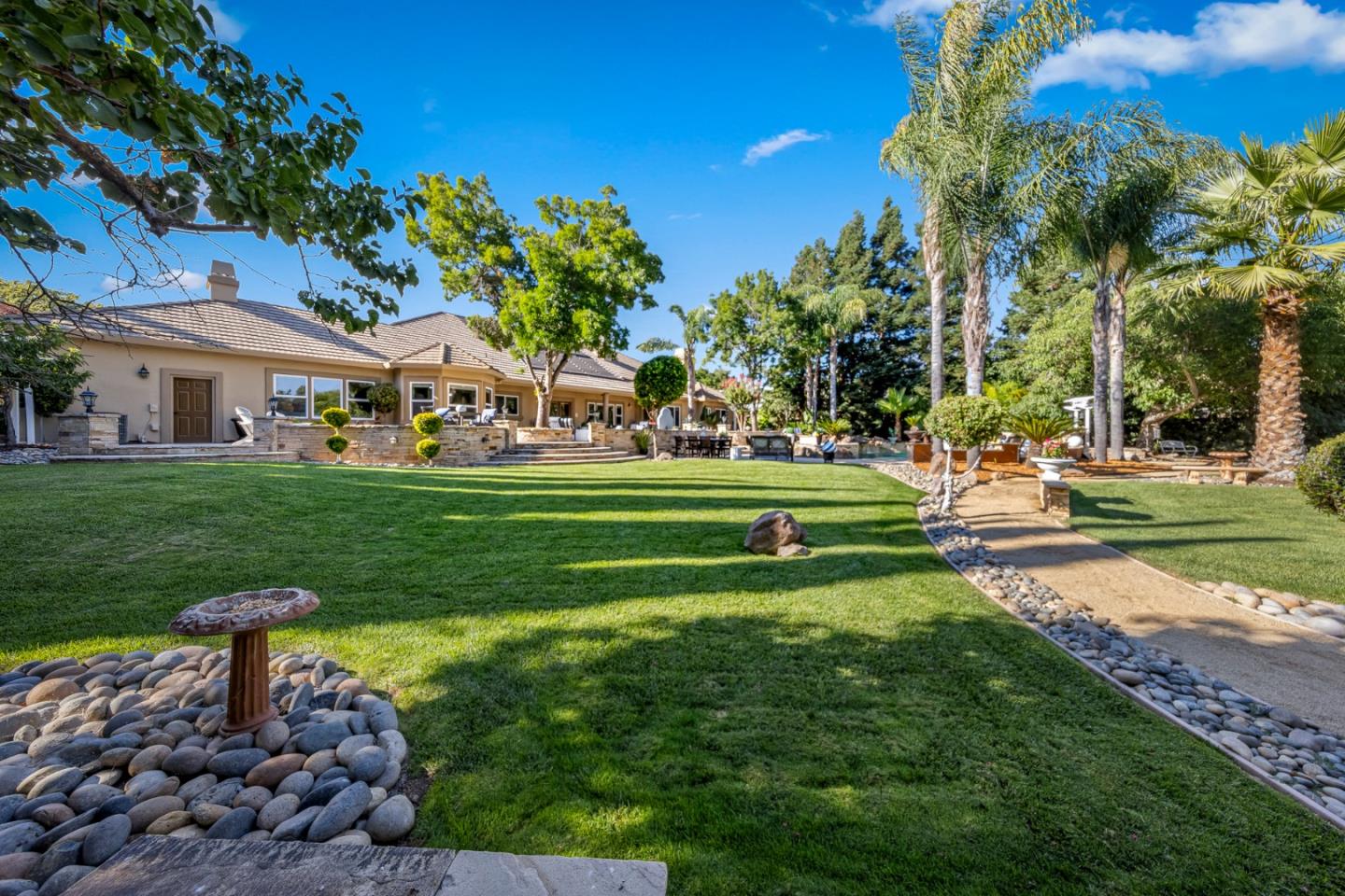 1980 Pear Drive Morgan Hill, CA 95037 - Photo 56 of 100 a front view of a house with garden and trees