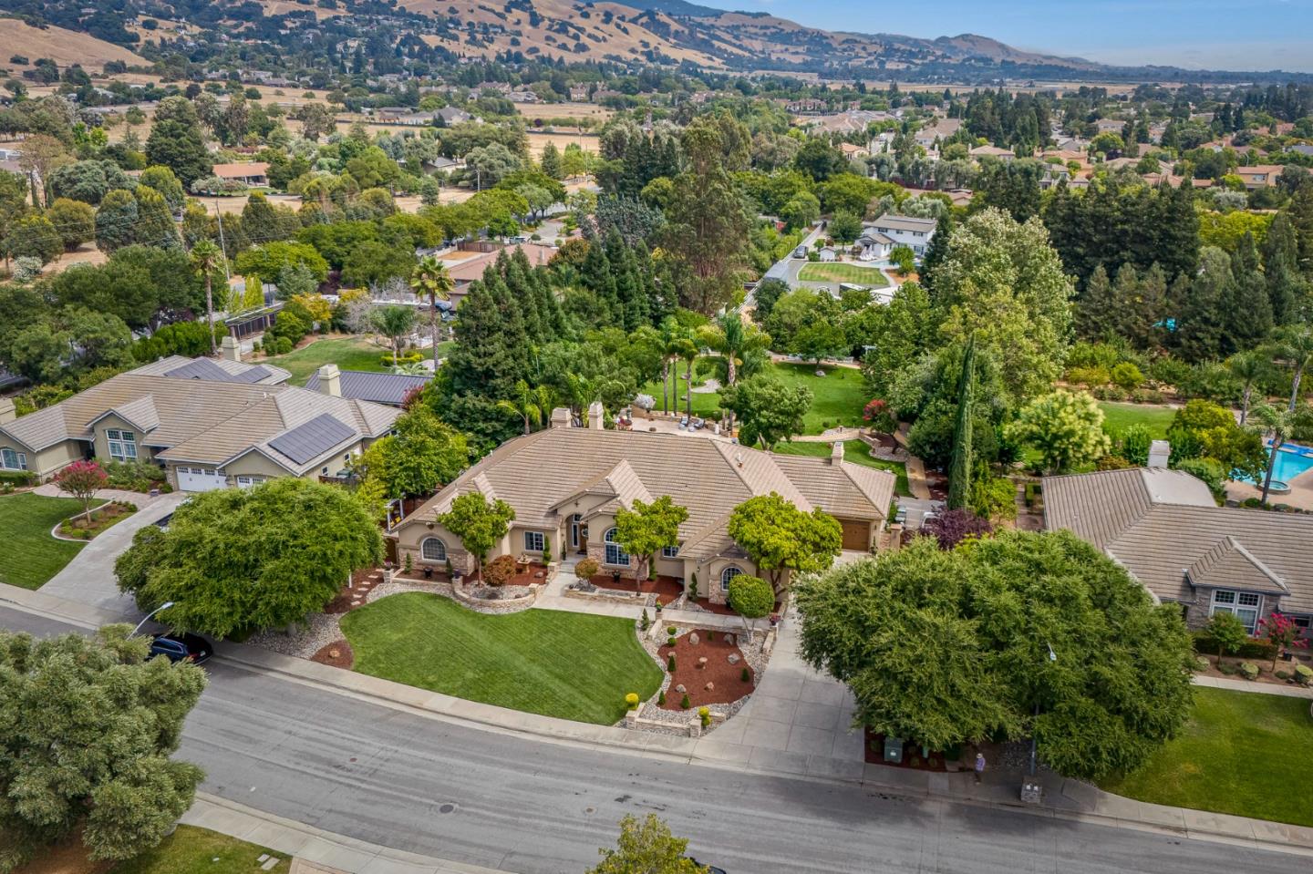 1980 Pear Drive Morgan Hill, CA 95037 - Photo 82 of 100 an aerial view of green landscape with trees houses and mountain view