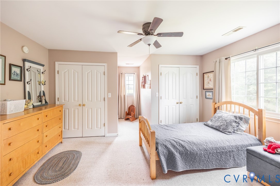 768 Hardtimes Road Farmville, VA 23901 - Photo 31 of 56 Carpeted bedroom featuring two sets of bi-fold clo