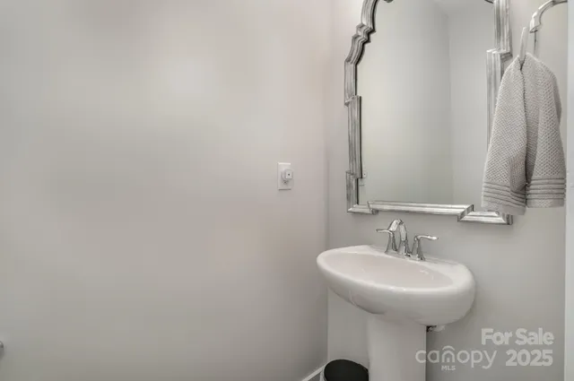 a bathroom with a sink and mirror