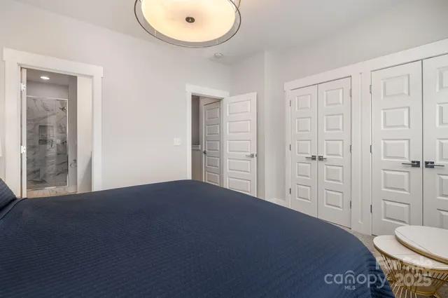 a bedroom with a bed and a sink