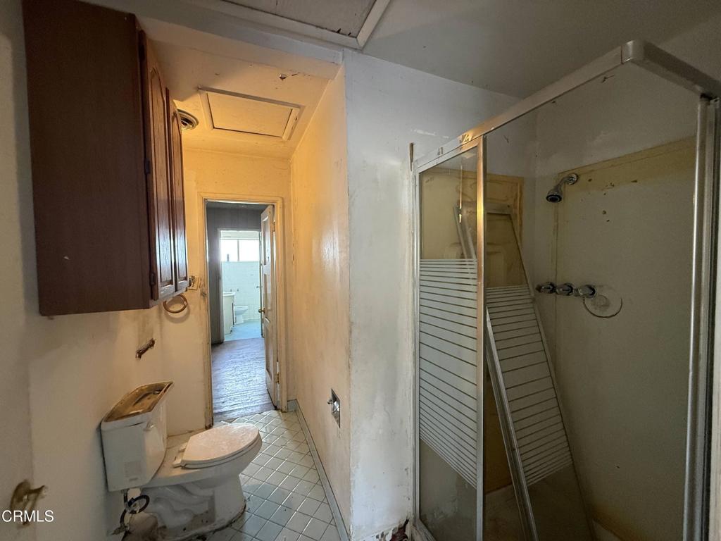 14306 Aztec Street Sylmar, CA 91342 - Photo 13 of 21 a bathroom with a granite countertop sink toilet and shower