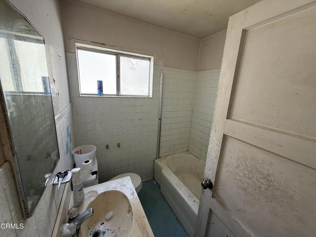 14306 Aztec Street Sylmar, CA 91342 - Photo 18 of 21 a bathroom with a sink and a toilet