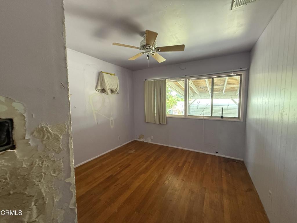 14306 Aztec Street Sylmar, CA 91342 - Photo 19 of 21 wooden floor in an empty room with a window