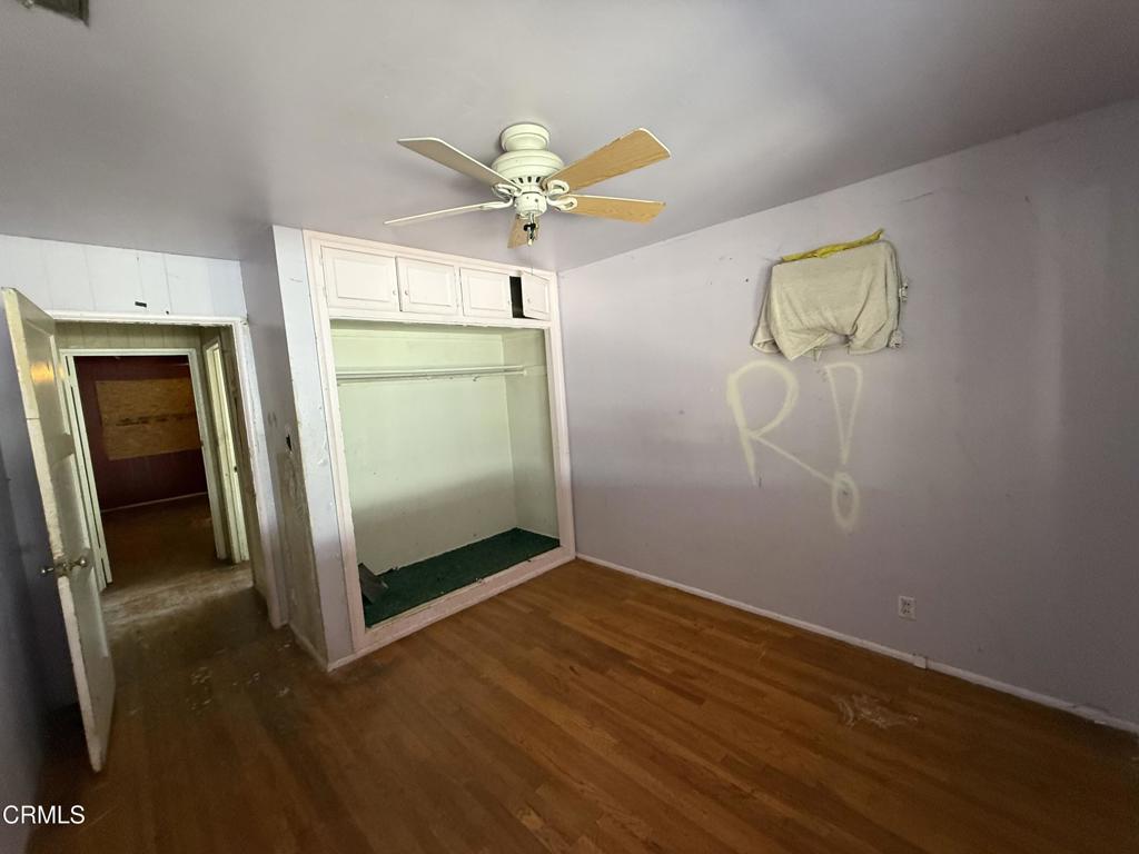 14306 Aztec Street Sylmar, CA 91342 - Photo 20 of 21 a view of an empty room with closet and wooden floor