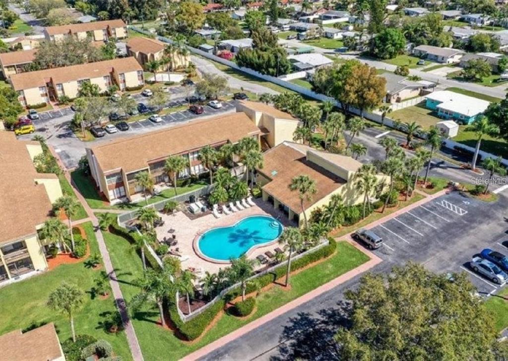 an aerial view of residential houses with outdoor space
