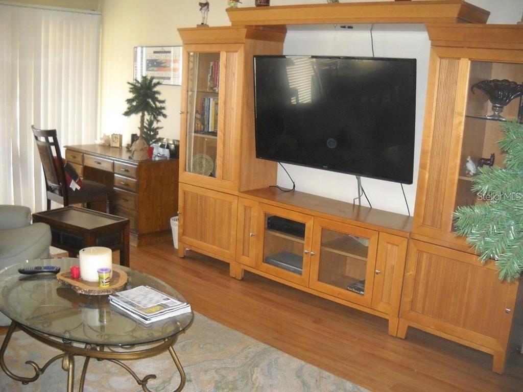 3471 Clark Road, Unit 269 Sarasota, FL 34231 - Photo 2 of 5 a living room with furniture