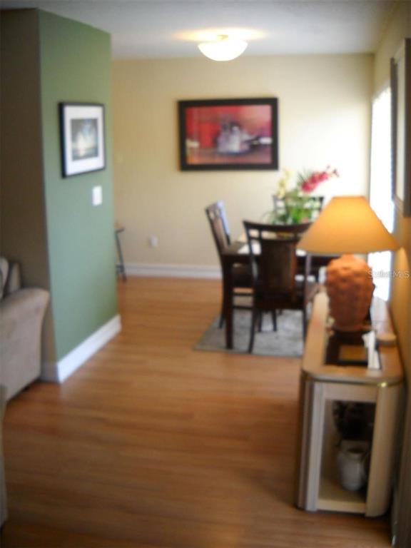 3471 Clark Road, Unit 269 Sarasota, FL 34231 - Photo 4 of 5 a living room with furniture and a fireplace
