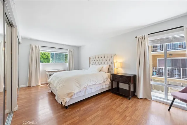 a spacious bathroom with a sink mirror and vanity