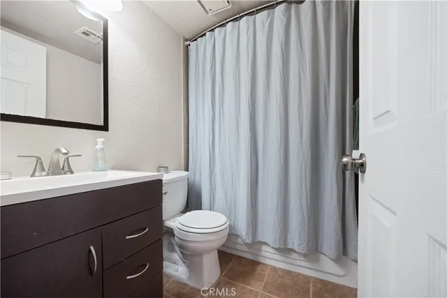 a bedroom with a bed and a table in it