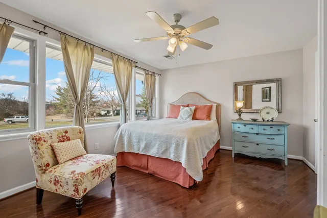 a spacious bedroom with a bed and a couch