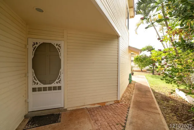 a view of a pathway of a house with backyard