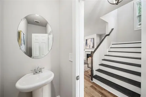 a bathroom with a sink and a mirror