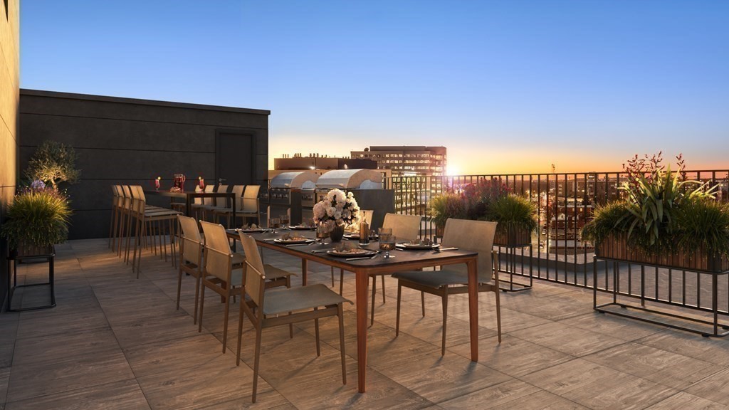 100 Lincoln Street, Unit 403 Boston, MA 02135 - Photo 20 of 23 a view of a terrace with furniture