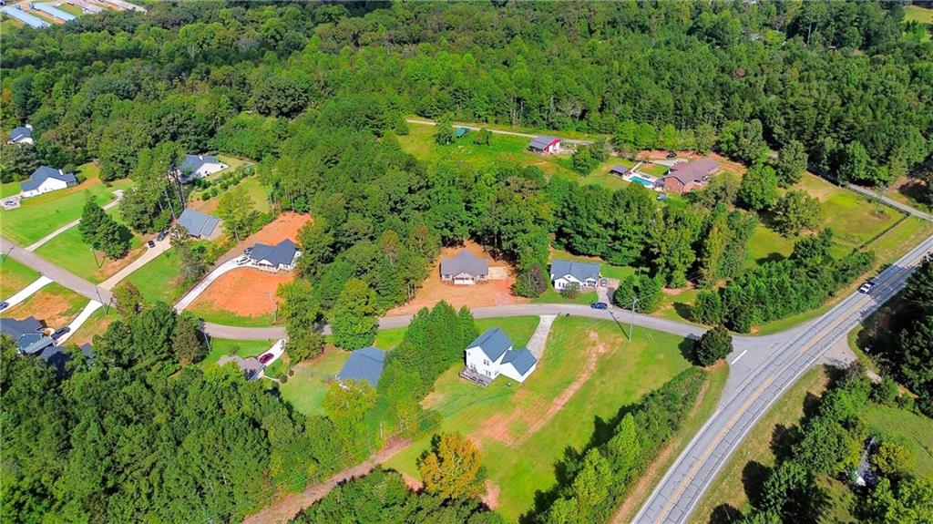 193 Tabitha Page Lane Toccoa, GA 30577 - Photo 29 of 33 an aerial view of a residential houses with yard and swimming pool