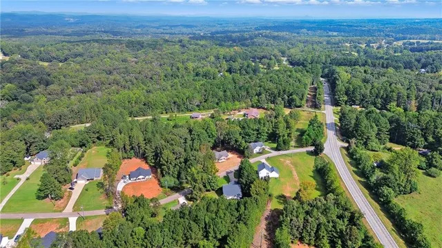 an aerial view of residential house with outdoor space and swimming pool