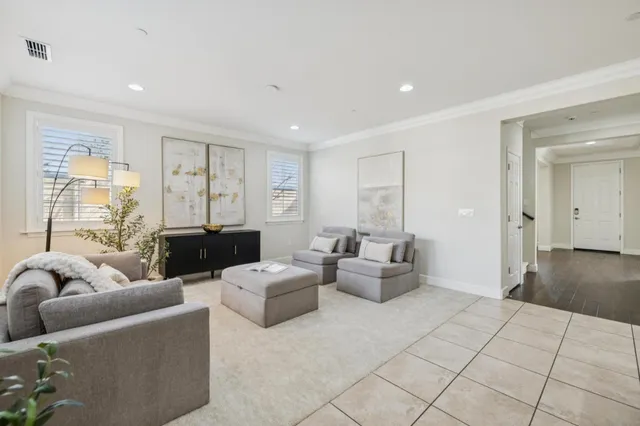 a kitchen with a table chairs sink and cabinets
