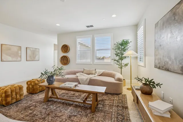 an empty room with a bathroom and a sink