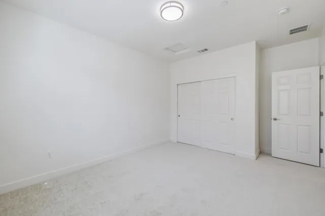 front view of house with a yard and sitting area